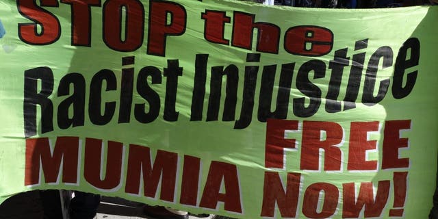 Free-Mumia protestors gather outside the Criminal Justice Center in Center City Philadelphia, PA, on August 30, 2013. 