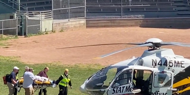 In this still image from video, author Salman Rushdie is taken on a stretcher to a helicopter for transport to a hospital after he was attacked during a lecture at the Chautauqua Institution in Chautauqua, N.Y., Friday, Aug. 12, 2022. 