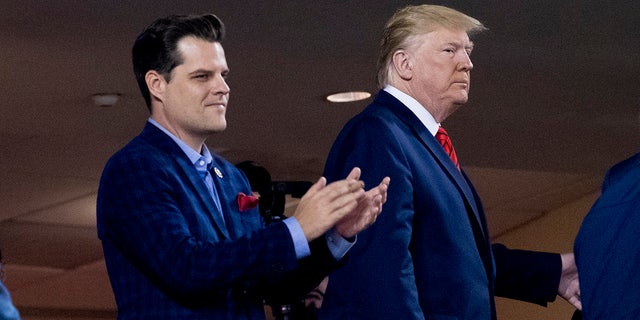 President Donald Trump, right, accompanied by Rep. Matt Gaetz, R-Fla., left, arrive for Game 5 of the World Series baseball game between the Houston Astros and the Washington Nationals at Nationals Park in Washington. (AP Photo/Andrew Harnik, File)