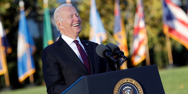 President Biden smiles during his remarks before signing the Infrastructure Investment and Jobs Act on the South Lawn at the White House in Washington on Nov. 15, 2021.