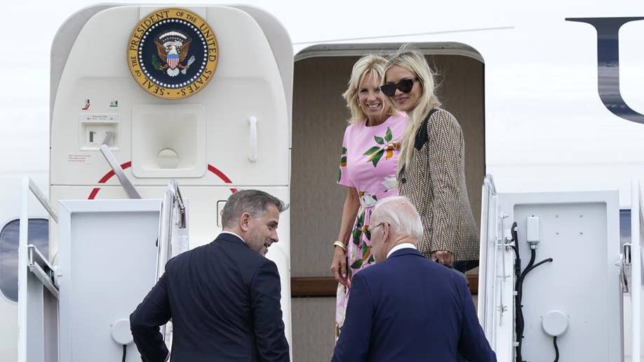 President Biden and his son climb staircase to Air Force One