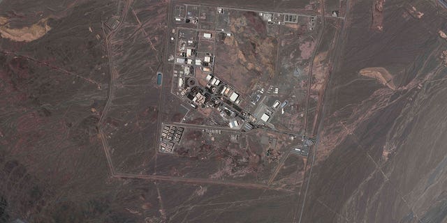 This satellite image from Planet Labs PBC shows Iran's underground Natanz nuclear site, as well as ongoing construction to expand the facility in a nearby mountain to the south, near Natanz, Iran, May 9, 2022. 