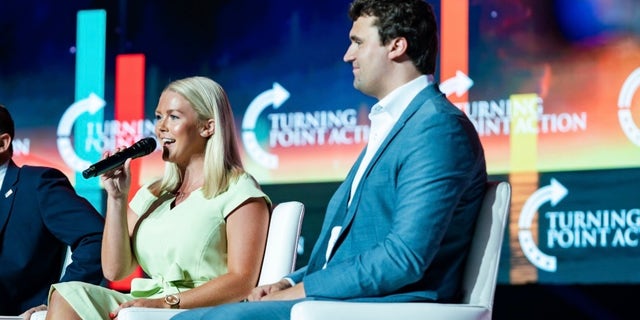 Karoline Leavitt has been endorsed by Turning Point USA founder and President Charlie Kirk, right.