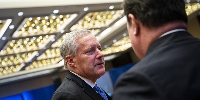 Mark Meadows, former White House chief of staff, speaks with an attendee during the America First Policy Institute's America First Agenda summit in Washington, D.C., US, on Monday, July 25, 2022. 
