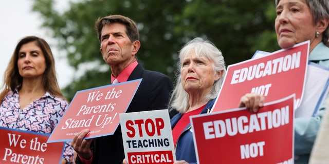 Opponents of the academic doctrine known as Critical Race Theory protest outside of the Loudoun County School Board headquarters, in Ashburn, Virginia, U.S.  June 22, 2021.