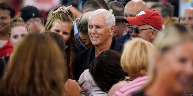Former Vice President Mike Pence greets fairgoers during a visit to the Iowa State Fair, Friday, Aug. 19, 2022, in Des Moines, Iowa. 