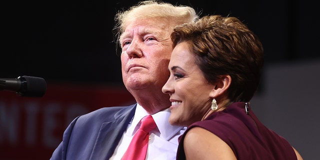 Former President Trump embraces Republican gubernatorial candidate Kari Lake at a rally in support of Arizona GOP candidates in Prescott Valley, Ariz., on July 22, 2022.