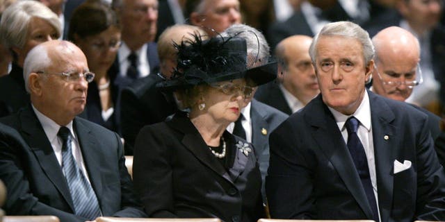 FILE - Former Soviet leader Mikhail Gorbachev, left, former British Prime Minister Margaret Thatcher and former Canadian Prime Minister Brian Mulroney attend the state funeral of former U.S. President Ronald Reagan at Washington National Cathedral in Washington, D.C.