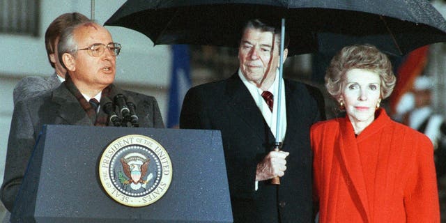 U.S. President Ronald Reagan, center, and his wife, Nancy, listen to Soviet leader Mikhail Gorbachev speak at the White House on Dec. 10, 1987.