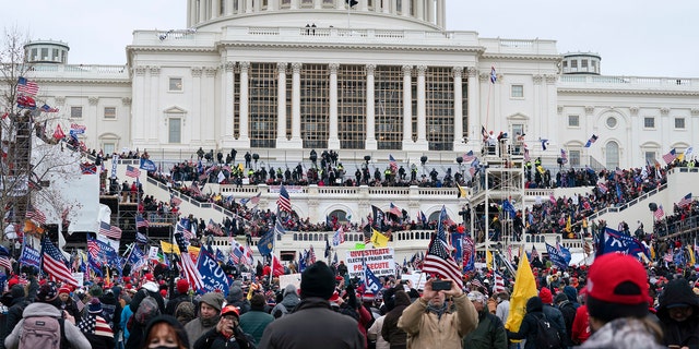 Trump supporters gather outside the Capitol, Wednesday, Jan. 6, 2021, in Washington. 