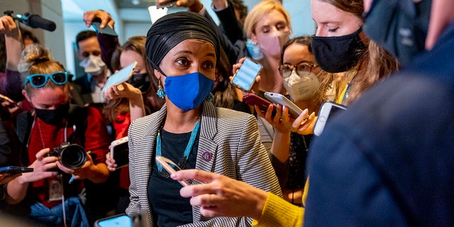 Rep. Ilhan Omar, D-Minn., speaks to reporters as she walks out of a House Democratic Progressive Caucus meeting on Capitol Hill in Washington, Thursday, Oct. 28, 2021.