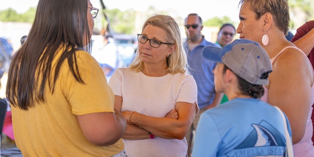 Rep. Liz Cheney talks with voters at Wyoming's Wind River Reservation, on July 16, 2022