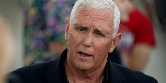 Former Vice President Mike Pence speaks to reporters during a visit to the Iowa State Fair in Des Moines, Iowa, on Aug. 19, 2022.