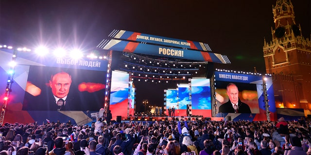 Russian President Vladimir Putin speaks during celebrations marking the incorporation of regions of Ukraine to join Russia in Red Square with the Spasskaya Tower on the right, in Moscow, Russia, Friday, Sept. 30, 2022. 