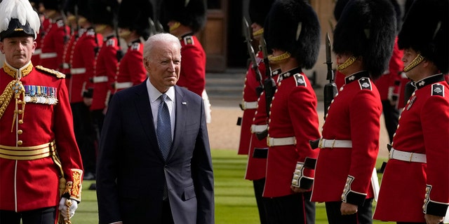 President Joe Biden inspects a Guard of Honour after arriving to meet Britain's Queen Elizabeth II at Windsor Castle near London, Sunday, June 13, 2021. (AP Photo/Matt Dunham, Pool)