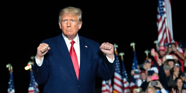 Former President Trump gestures as he holds a rally Friday, Sept. 23, in Wilmington, North Carolina.