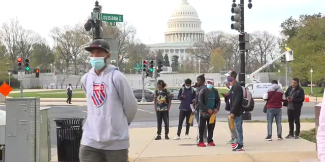 A group of migrants were bused from Texas to Washington, D.C., where they were dropped off blocks from the U.S. Capitol on April 13, 2022. 