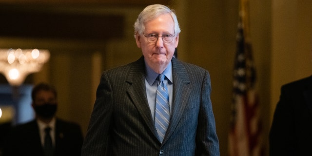 Senate Minority Leader Mitch McConnell, a Republican from Kentucky, walks to the Senate floor at the U.S. Capitol in Washington, on Tuesday, Jan. 18, 2022.