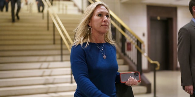 FILE - Rep. Marjorie Taylor Greene, R-Ga., arrives for a meeting at the Capitol in Washington, Thursday, May 13, 2021.