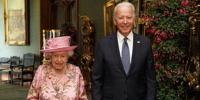 Queen Elizabeth II with US President Joe Biden in the Grand Corridor during their visit to Windsor Castle on June 13, 2021, in Windsor, England. Queen Elizabeth II hosts US President, Joe Biden and First Lady Dr Jill Biden at Windsor Castle.