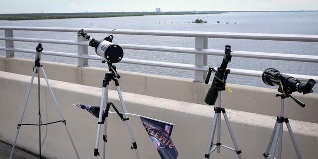 Telescopes sit at the Parrish Park bridge after the launch of the Artemis I unmanned lunar rocket was postponed, in Titusville, Florida, on September 3, 2022.