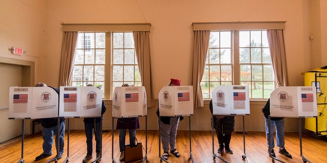 Voters fill out their ballots at the Old Stone School polling location in Hillsboro, Virginia, on Election Day, Nov. 6, 2018.