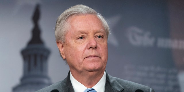 FILE - Sen. Lindsey Graham, R-S.C., speaks with reporters about aid to Ukraine, on Capitol Hill, Wednesday, March 10, 2022, in Washington. Attorneys representing Graham said Wednesday, July 6, that he intends to challenge a subpoena compelling him to testify before a special grand jury in Georgia investigating former President Donald Trump and his allies' actions after the 2020 election. 