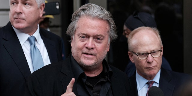 Former Trump White House chief strategist Steve Bannon speaks with the media at the end of the opening day of his trial on contempt of Congress charges. 