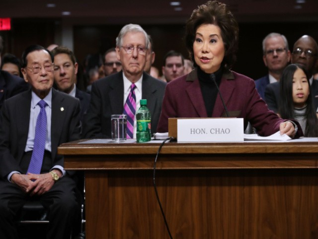 Elaine Chao testifies during her confirmation hearing to be the next U.S. secretary of transportation before the Senate Commerce, Science and Transportation Committee as her husband, Senate Majority Leader Mitch McConnell (R-KY) (3rd L) and her father Dr. James Chao (L) look on, in the Dirksen Senate Office Building on Capitol Hill January 11, 2017 in Washington, DC. Chao, who has previously served as secretary of the Labor Department, was nominated by President-elect Donald Trump. (Photo by Chip Somodevilla/Getty Images)