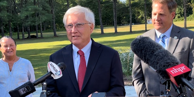 State Senate President Chuck Morse, with Gov. Chris Sununu, right, takes questions from reporters, in Concord, New Hampshire, on Sept. 8, 2022.