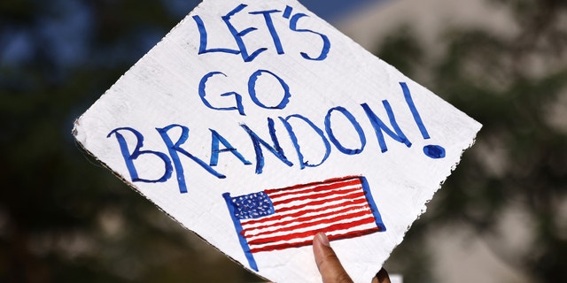 A protestor holds a 'Let's Go Brandon!' sign in Grand Park at a ‘March for Freedom’ rally demonstrating against the L.A. City Council’s COVID-19 vaccine mandate for city employees and contractors on November 8, 2021.