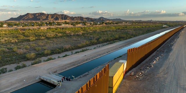 Some gaps in the border fence built by the Trump administration were recently filled with shipping containers by the Arizona state government, making it more difficult for immigrants to cross in certain areas. 