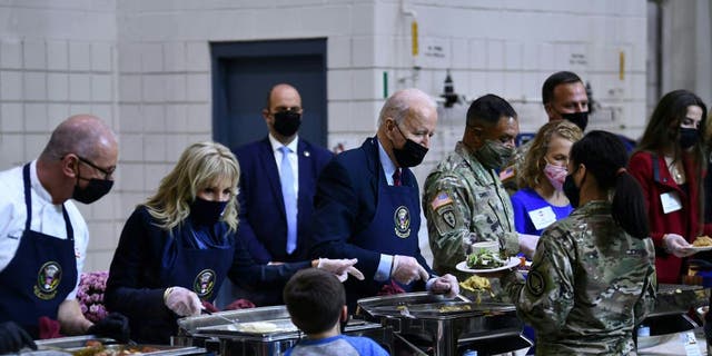 President Joe Biden and first lady Jill Biden serve food to soldiers and their families at Fort Bragg.