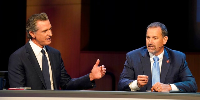 Gubernatorial candidates, Democratic Gov. Gavin Newsom, left, and Republican challenger state Sen. Brian Dahle spar during their debate held by KQED Public Television in San Francisco, on Sunday, Oct. 23, 2022.