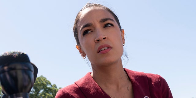 Rep. Alexandria Ocasio-Cortez, D-N.Y., speaks with reporters, Thursday, June 17, 2021, as she arrives on Capitol Hill in Washington. (AP Photo/Jacquelyn Martin)