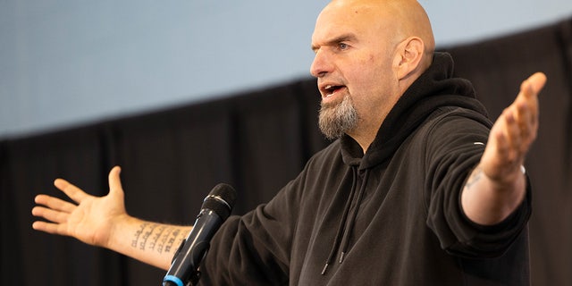 Pennsylvania Lt. Gov. John Fetterman, Democratic candidate for U.S. Senate, accompanied by Rep. Dwight Evans, D-Pa., speaks in Philadelphia, Saturday, Sept. 24, 2022. 