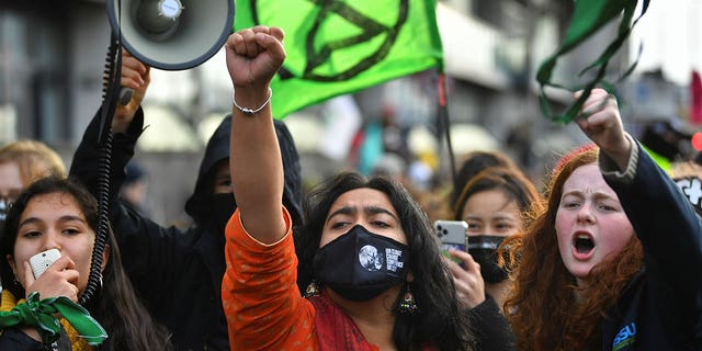 Climate activists demonstrate outside the UN Climate Change Conference (COP26) venue, in Glasgow, Scotland, November 12, 2021.