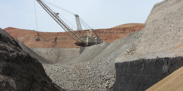 A dragline excavator moves rocks above a coal seam at the Spring Creek Mine in Decker, Montana, in 2013. The mine is operated by the Navajo Transitional Energy Company.