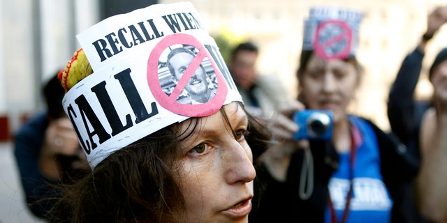 Nudist Gypsy Taub speaks with reporters after removing her clothing at the U.S. Courthouse in San Francisco, California January 17, 2013. Nudists gathered prior to a hearing on a lawsuit seeking to block implementation of San Francisco's ban on public nudity. 