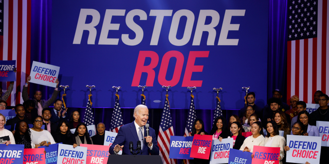  U.S. President Joe Biden waves to the crowd as he departs from a Democratic National Committee event at the Howard Theatre on Oct. 18, 2022, in Washington, DC. With three weeks until election day, in his remarks Biden highlighted issues pertaining to women’s reproductive health and promised to codify access to abortion.