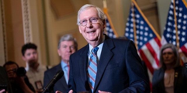 Senate Minority Leader Mitch McConnell speaks with reporters following a closed-door policy lunch at the Capitol.