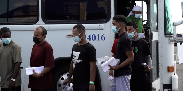 A Customs and Border Protection bus drops off dozens of migrants, mostly from Venezuela, at the city of El Paso's migrant welcome center Sept. 22, 2022.