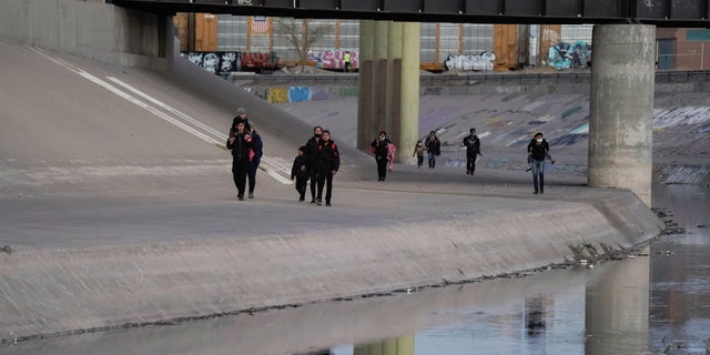 Migrants cross the border into El Paso March 17, 2021, as seen from Ciudad Juarez, Mexico. El Paso has seen a surge of migrants in September 2022, putting a strain on city resources and local nonprofits.