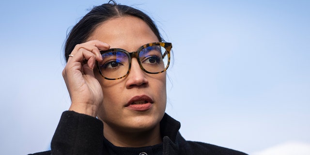 Rep. Alexandria Ocasio-Cortez (D-NY) prepares to speak during a rally for immigration provisions to be included in the Build Back Better Act outside the U.S. Capitol December 7, 2021 in Washington, DC. Progressive Democrats are urging the Senate to include a pathway to citizenship for undocumented immigrants living in the U.S. in the Build Back Better Act.