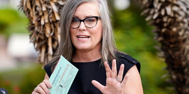 Arizona Secretary of State Katie Hobbs speaks to the media before dropping off her primary election ballot July 21, 2022, in Scottsdale, Ariz. 