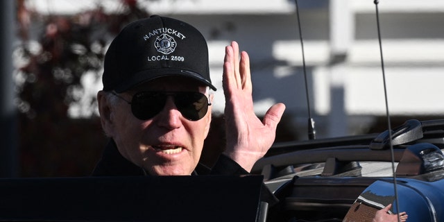 President Biden waves as he leaves after visiting a Nantucket, Massachusetts, fire station to thank first responders during the Thanksgiving Day holiday, on Nov. 24, 2022.