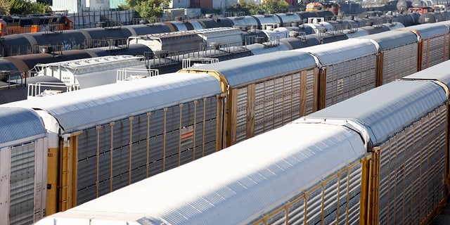 Freight cars sit in a rail yard on Nov. 22, 2022, in Wilmington, California.