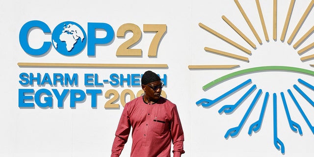 A man walks outside of the Sharm El Sheikh International Convention Centre during the COP27 climate summit opening in Egypt's Red Sea resort of Sharm el-Sheikh, Egypt November 6, 2022.