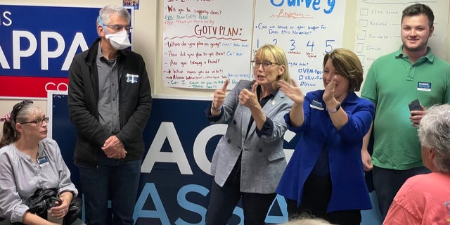 Sens. Maggie Hassan, center, and Amy Klobuchar of Minnesota, speak to supporters at a Democratic Party campaign office in Exeter, New Hampshire, on Nov. 6, 2022.