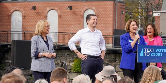 Sen. Maggie Hassan, left, and Rep. Annie Kuster, right, are joined by Transportation Secretary Pete Buttigieg and Sen. Amy Klobuchar on Nov. 6, 2022, at a rally in Nashua, New Hampshire.